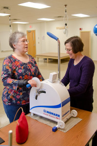Occupational therapist works with an adult client in Carroll Hall OT clinic